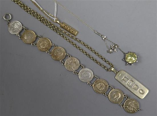A 9ct gold ingot necklace, a similar silver necklace, a coin bracelet and a paste necklace.